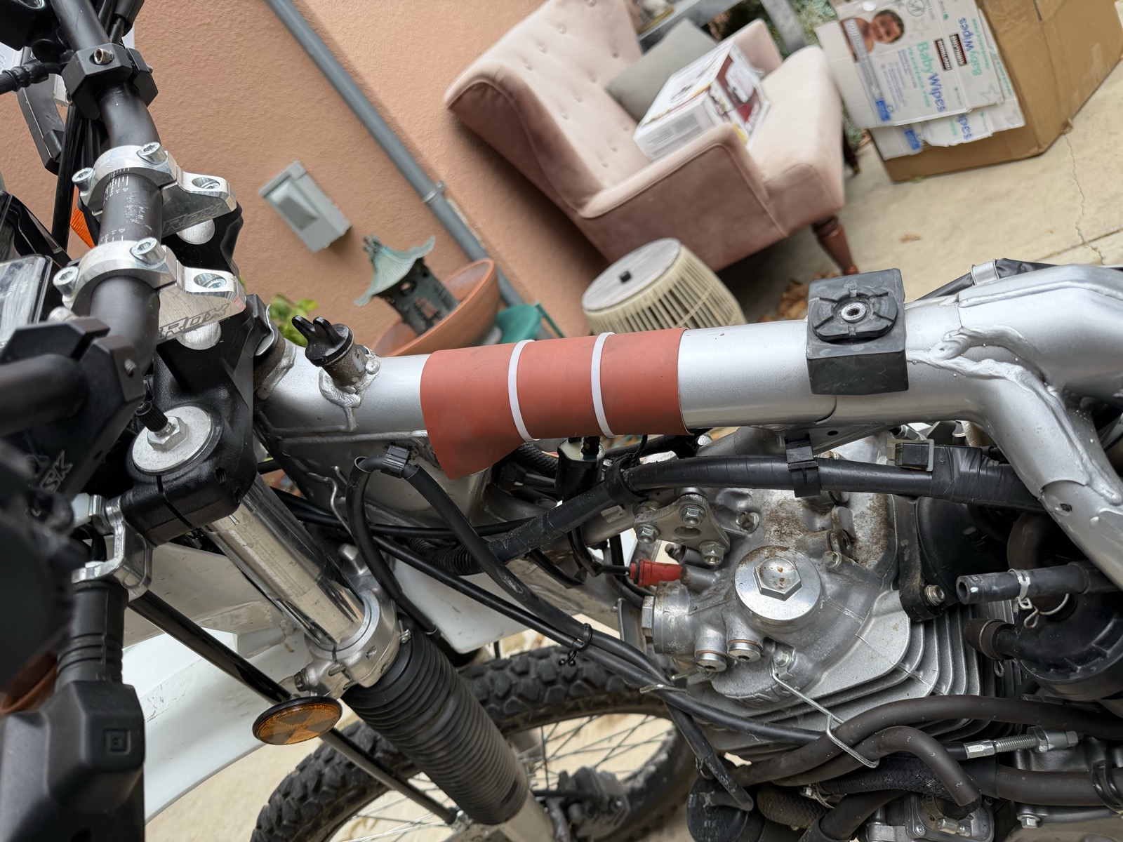Gasket rubber zip-tied to the chassis for wear and vibration resistance