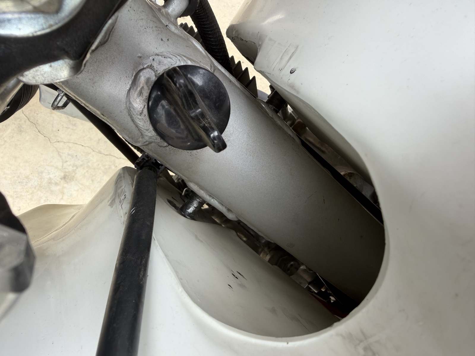Stock nubs on the chassis foul the Acerbis tank
