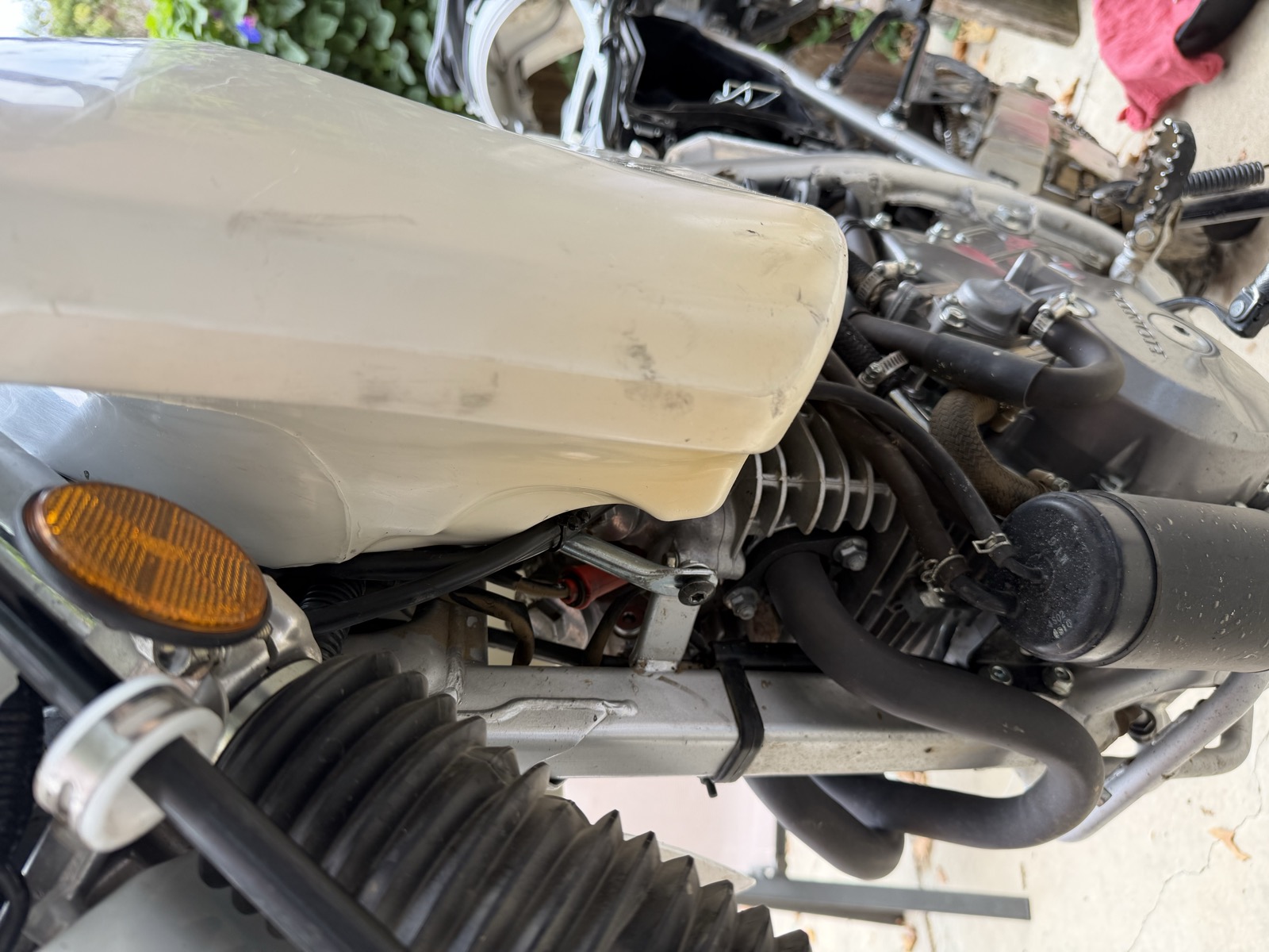Attaching the tank at the old fairing bolt holes